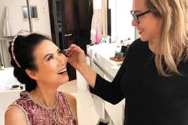 makeup artist putting latin america