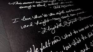asmr writing quotes on black paper a white pen 