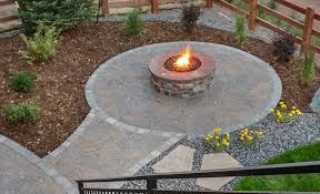 Create the first tier of the fire pit by forming a circle finish off your fire pit project by spreading the remaining river rock in the bottom of the pit to help with drainage and to reduce weed growth. Fire Pit Ideas The Home Depot