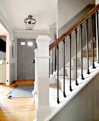With the rest of the staircase painted white, this stair rail is the focus. Diy Stair Railing Makeover The Painted Home By Denise Sabia