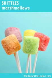 coat marshmallows in rainbow skittles candy