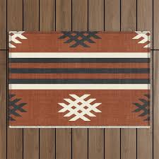 otto in rust outdoor rug by house of