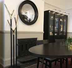 Round Mirrors Over A Fireplace