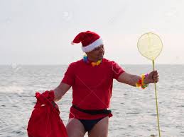 Naughty Mature Man In Santa Claus Clothes With Big Red Bag Full Of Gifts On  The Background Of The Sea Stock Photo, Picture and Royalty Free Image.  Image 87061952.