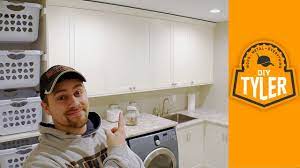 Cover up the gaps around the edges with molding. Laundry Room Cabinets Epic Room Reveal Youtube