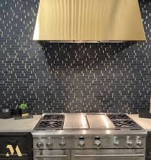 Houston kitchen remodeling contractors fees, expenses for new appliances, and everything that comes to mind. Stunning Showroom Design With Monogram Appliances Sleek Black Tile And Brass Range Hood At In 2021 Professional Kitchen Appliances Showroom Design Monogram Appliances