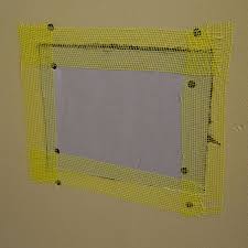 Drywall Patch With Mesh Tape Around The