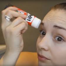 glue sticks to get perfect eyebrows