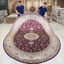 oval persian silk carpet red
