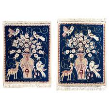 pair of vine pictorial nain rugs for