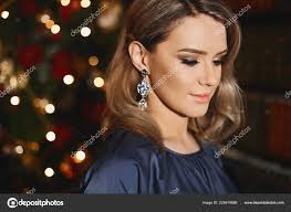 bright makeup and with trendy earrings