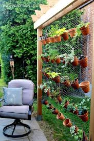 Vertical Herb Gardening With Clay Pots