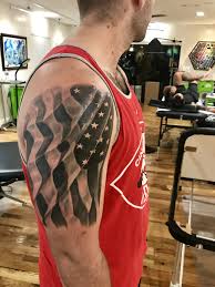 Choose the american flag with an eagle tattoo. American Flag Black And Grey Forearm Tattoo Men American Flag Tattoo Flag Tattoo