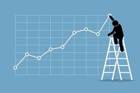 Businessman Climbing Up On A Ladder To Adjust An Uptrend