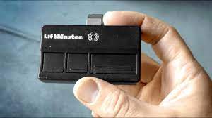 How to program a Garage Door Remote & change battery LiftMaster Chamberlain  - YouTube