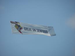 banner towing by ocean aerial ads