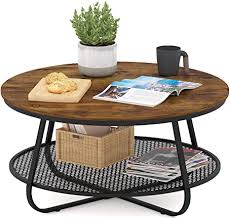 It's actually the type of coffee table you'd expect to see in most modern living rooms. Amazon Com Teraves Industrial Coffee Table For Living Room Round Coffee Table With Storage Shelf Modern Coffee Table With Metal Frame Easy Assembly Kitchen Dining
