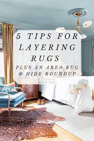layering rugs plus an area rug