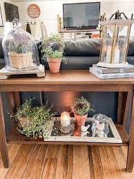 3 ways to decorate a sofa table for