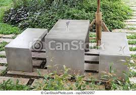 Concrete outdoor furniture concrete stool concrete dining table concrete crafts patio furniture sets furniture ideas urban. Concrete Outdoor Furniture Set In The Small Garden Stock Photo Canstock