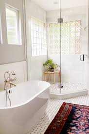 This primary bathroom features beautiful tiles floors. Bathroom With Corner Walk In Shower Hgtv