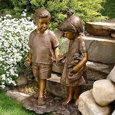 bronze yard statues of children is cast
