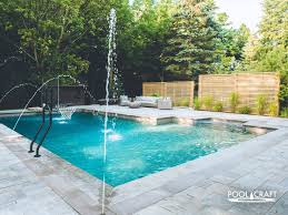 Stunning stone pool wall and water feature. Water Features Pool Craft