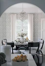 A bright white dining room. Round Black Dining Table With Black Klismos Dining Chairs Transitional Dining Room