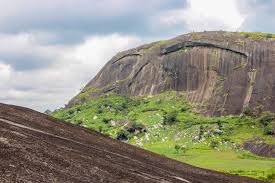 It rises spectacularly immediately north of nigeria's capital abuja, along the main road from abuja to kaduna, and is sometimes referred to as the gateway to abuja. Hiking In Abuja Zuma Rock Suleja Princess Audu