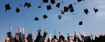graduates throwing hat in air
