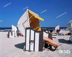 Badestrand, nackte Maedchenbeine ragen aus einem Strandkorb heraus,  D-Usedom, D-Bansin, Seebad, Stock Photo, Picture And Rights Managed Image.  Pic. VIG-4347680 | agefotostock