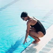 female swimmer on poolside stock photo