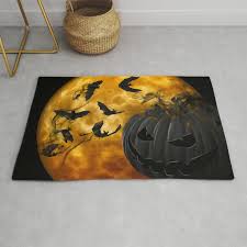 evil pumpkin face and bats at full moon