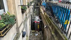 Man Wedges Car Into Basement Alley Of