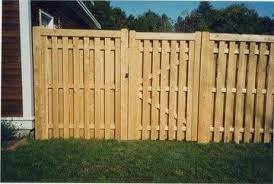 Rustic white cedar stockade fence with transition. Privacy Fences Shadow Box Fence Privacy Fences Fence