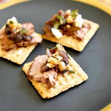 triscuit appetizer with blue cheese and