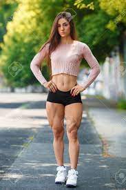 Beautiful Muscular Girl Posing Outdoor. Sexy Athletic Woman With Big Quads  Stock Photo, Picture and Royalty Free Image. Image 76487543.