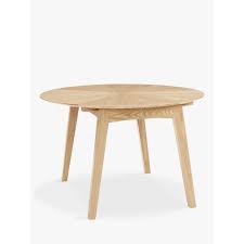 Stark extending dining table with glass, ceramic or laminate top mounted on a trestle base. John Lewis Partners Duhrer 4 6 Seater Extending Round Dining Table Oak