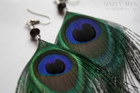 Use feathers as wedding decor, details and accessories. Peacock Feather Earrings Diy Simply Allis