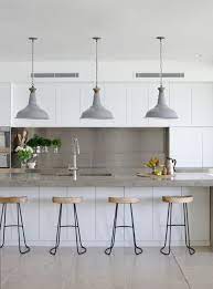 This traditional kitchen has white lower cabinets and gray overhead cabinets. Kitchenshomedesigns Interior Design Kitchen Concrete Countertops Kitchen Contemporary Kitchen