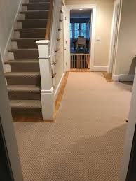 wood stairs with carpet runner carried