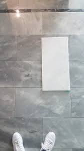 white marble tile turned gray after install