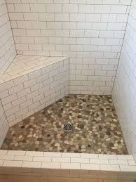 White Subway Tile With River Rock Floor