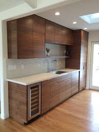 kitchen with walnut cabinetry and heath