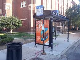 bus stop shelter advertising blue