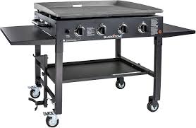 What is the price range for flat top grills? Amazon Com Blackstone 1554 Cooking 4 Burner Flat Top Gas Grill Propane Fuelled Restaurant Grade Professional 36 Outdoor Griddle Station With Side Shelf Black Garden Outdoor