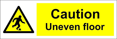 caution uneven floor warning