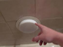 changing light bulb over tub shower