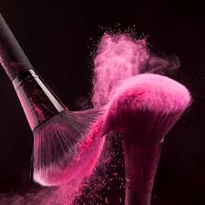 makeup brushes with pink powder haze