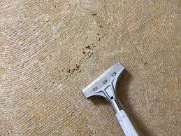 remove old carpet glue from concrete